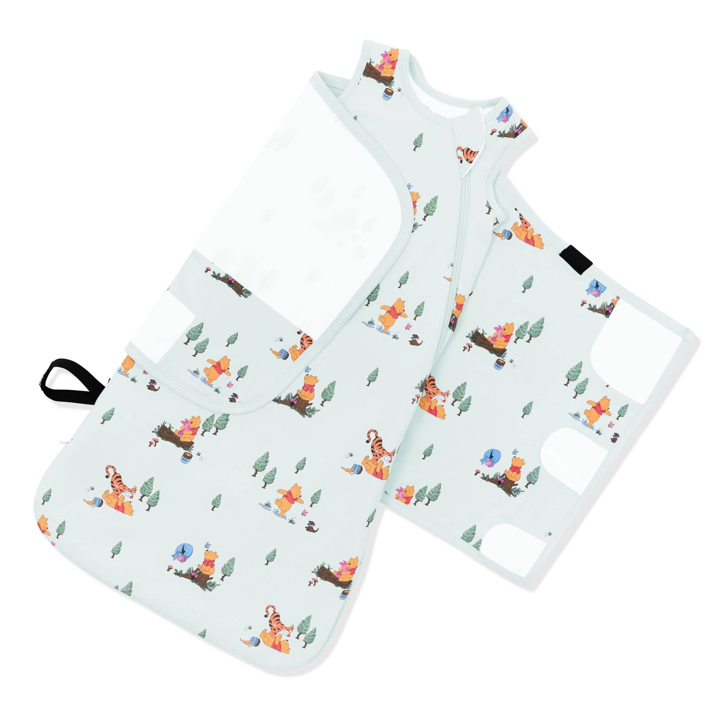 The adjustable swaddle wrap shown on an unswaddled Sleep Bag Swaddler in Winnie the Pooh Hundred Acre Wood 1.0
