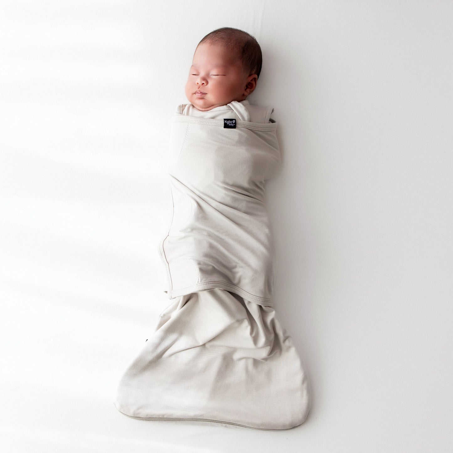 Newborn swaddled in bamboo Sleep Bag Swaddler in Oat 0.5