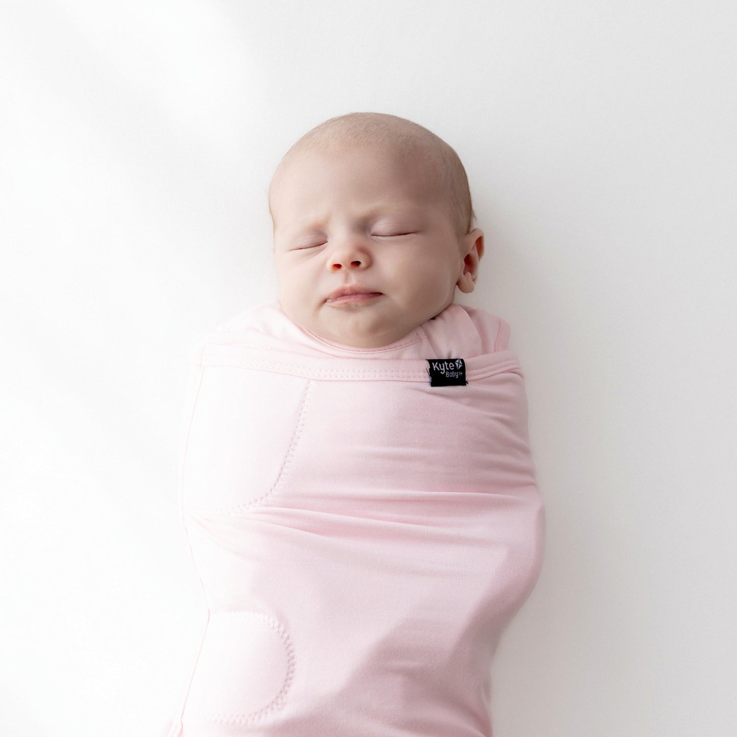Baby asleep in Sleep Bag Swaddler in Sakura 0.5 close up