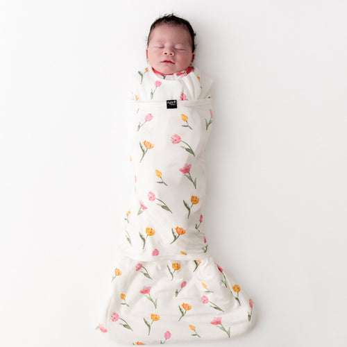 sleeping newborn swaddled in the Sleep Bag Swaddler in Tulip 1.0